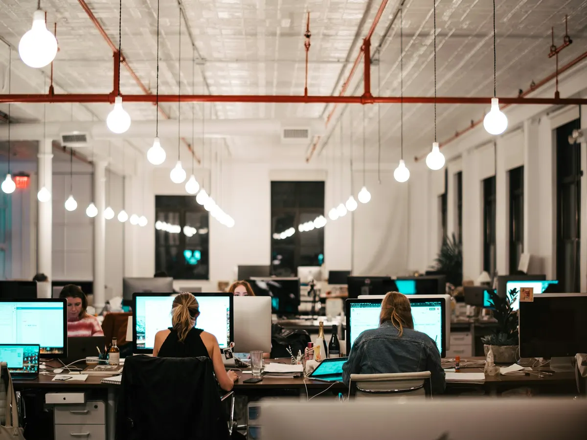 A team working at computers in an open-plan office